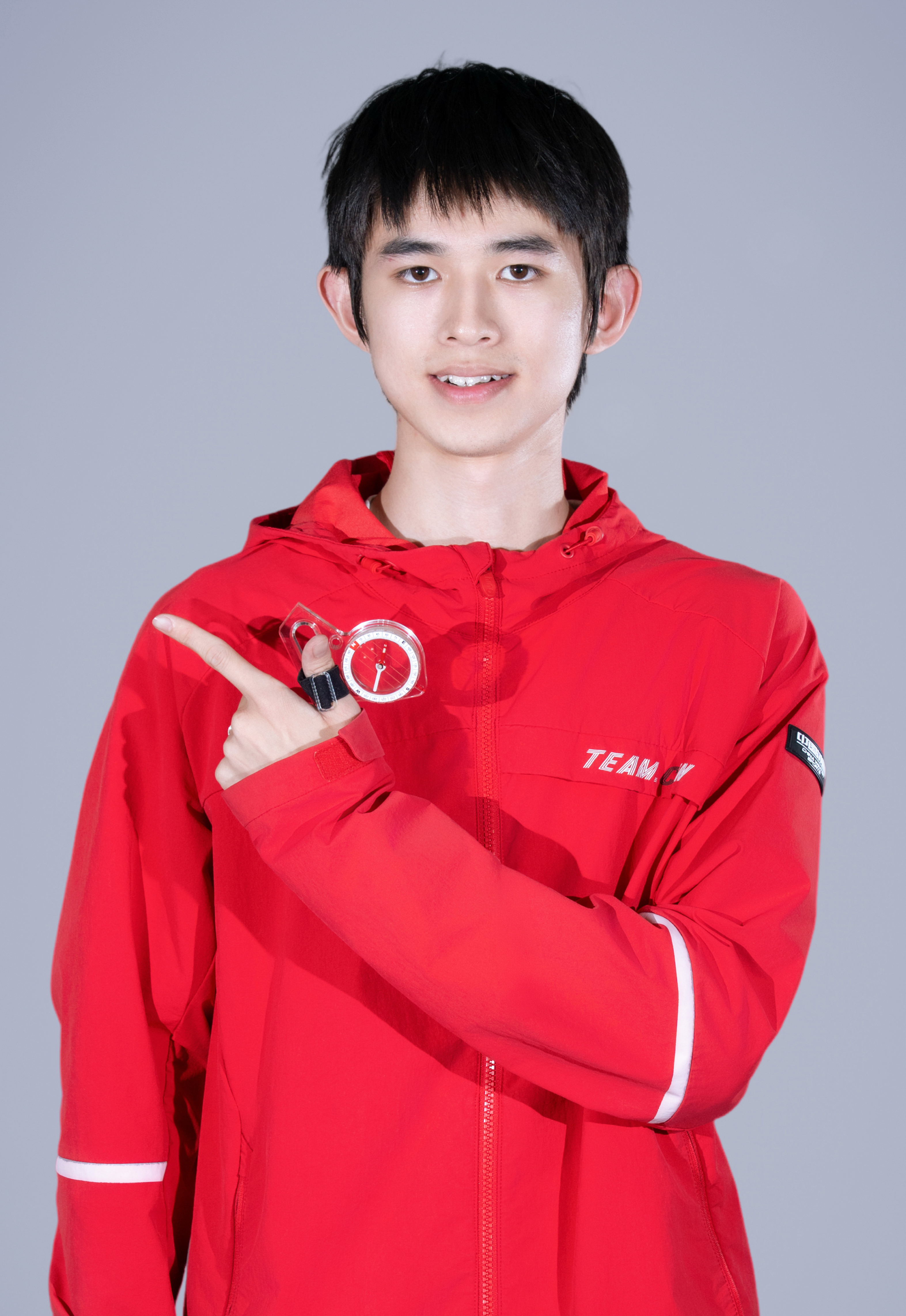 Yudi Xie holding a compass